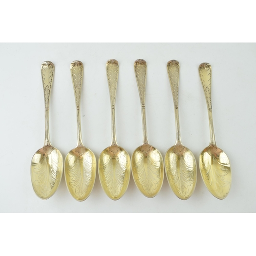 291 - A set of six Victorian silver gilt dessert spoons, with engraved decoration, ornate bowls, four are ... 