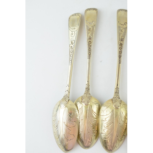 291 - A set of six Victorian silver gilt dessert spoons, with engraved decoration, ornate bowls, four are ... 