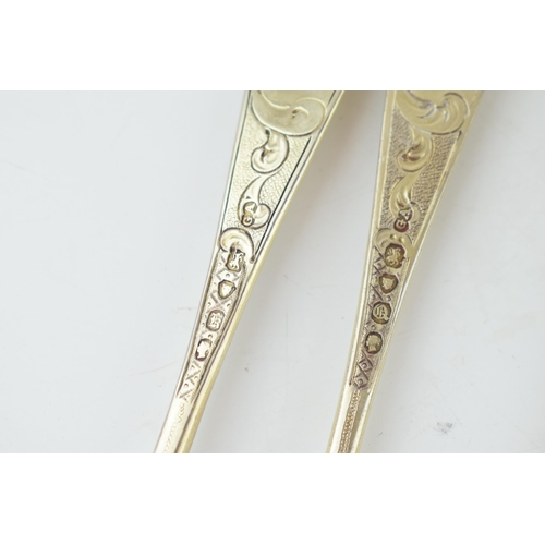 291 - A set of six Victorian silver gilt dessert spoons, with engraved decoration, ornate bowls, four are ... 