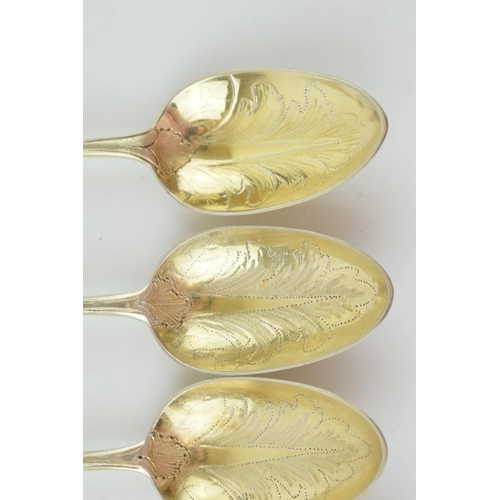 291 - A set of six Victorian silver gilt dessert spoons, with engraved decoration, ornate bowls, four are ... 