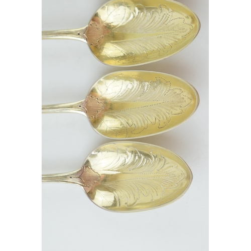 291 - A set of six Victorian silver gilt dessert spoons, with engraved decoration, ornate bowls, four are ... 