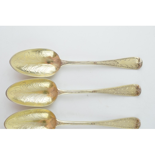 291 - A set of six Victorian silver gilt dessert spoons, with engraved decoration, ornate bowls, four are ... 