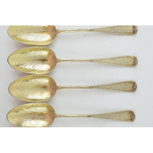 291 - A set of six Victorian silver gilt dessert spoons, with engraved decoration, ornate bowls, four are ... 