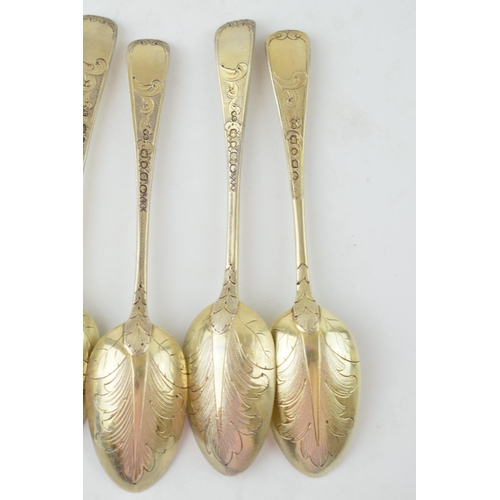 291 - A set of six Victorian silver gilt dessert spoons, with engraved decoration, ornate bowls, four are ... 