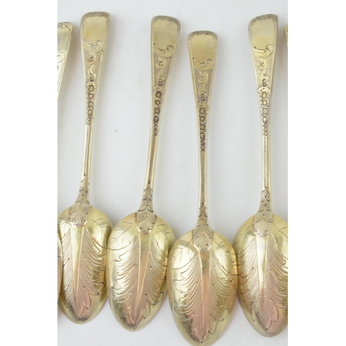 291 - A set of six Victorian silver gilt dessert spoons, with engraved decoration, ornate bowls, four are ... 