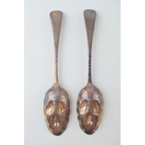 292 - A pair of Georgian silver fruit spoons, ornate handles, embossed bowls, 20cm long, hallmarks rubbed,... 