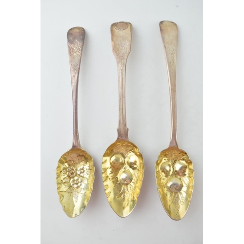 293 - Three Georgian singular silver fruit spoons, all with embossed bowls and ornate handles, gilt wash t... 