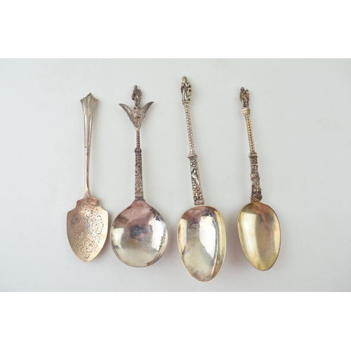 294 - Four silver spoons to include two continental examples with ornate finials, one with import marks, a... 