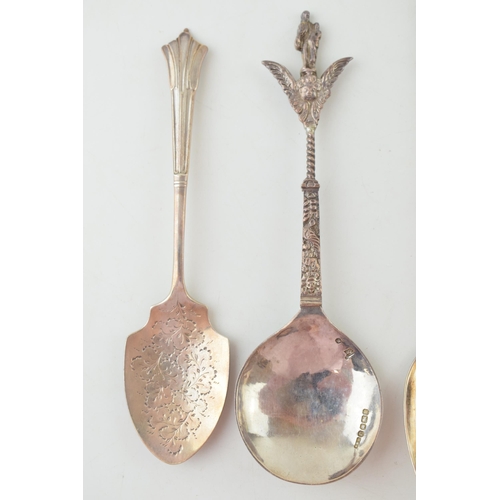 294 - Four silver spoons to include two continental examples with ornate finials, one with import marks, a... 