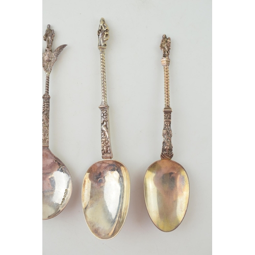 294 - Four silver spoons to include two continental examples with ornate finials, one with import marks, a... 