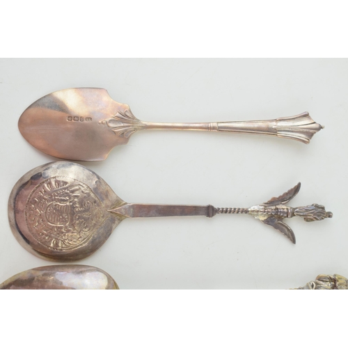 294 - Four silver spoons to include two continental examples with ornate finials, one with import marks, a... 