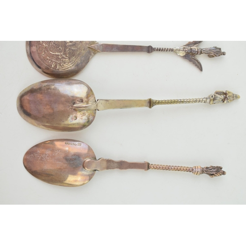 294 - Four silver spoons to include two continental examples with ornate finials, one with import marks, a... 