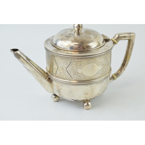 295 - Victorian silver teapot, ivory space heaters, engraved decoration, London 1883, 410.0g. Ivory submis... 