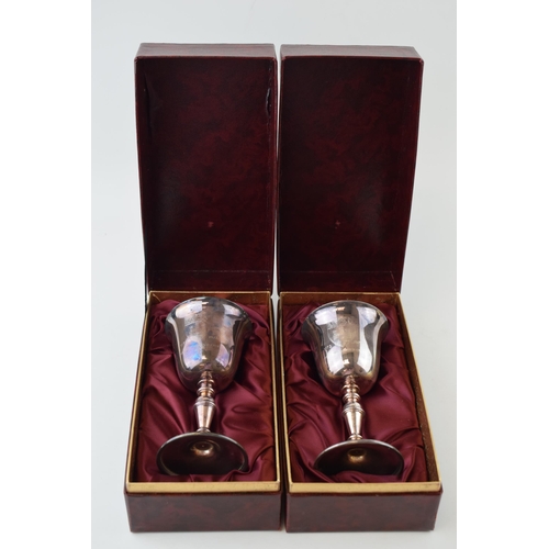 302 - A pair of hallmarked silver goblets, to mark the 'Octocentenary of Newcastle Under Lyme', gilt inter... 