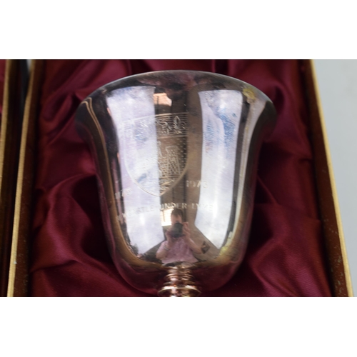 302 - A pair of hallmarked silver goblets, to mark the 'Octocentenary of Newcastle Under Lyme', gilt inter... 