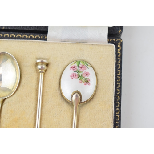 321 - A cased set of six silver tea spoons, with enamelled decoration to rear with floral decoration, 58.4... 