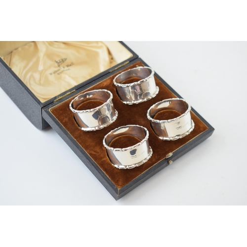 322 - A set of cased 'Walker & Hall Sheffield' silver napkin rings. Hallmarked Birmingham 1938. Weight 76 ... 