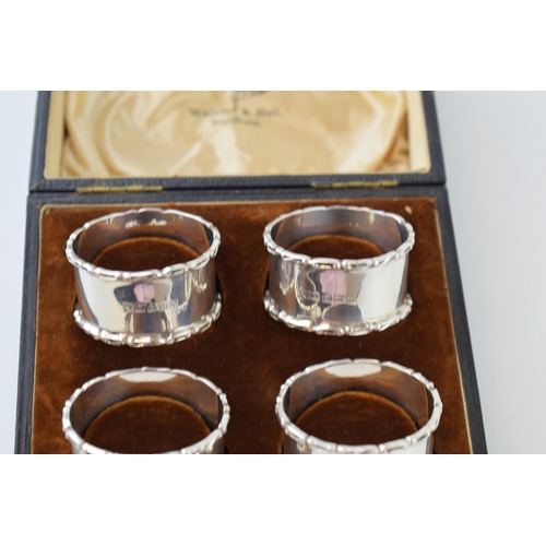 322 - A set of cased 'Walker & Hall Sheffield' silver napkin rings. Hallmarked Birmingham 1938. Weight 76 ... 