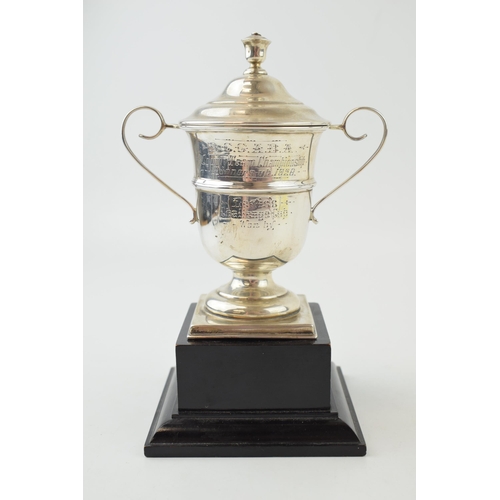 331 - Silver lidded cup on plinth 'County Team Championship 1928' Hallmarked Sheffield 1928. Weight 119.3 ... 