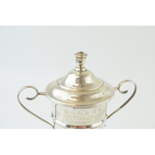 331 - Silver lidded cup on plinth 'County Team Championship 1928' Hallmarked Sheffield 1928. Weight 119.3 ... 