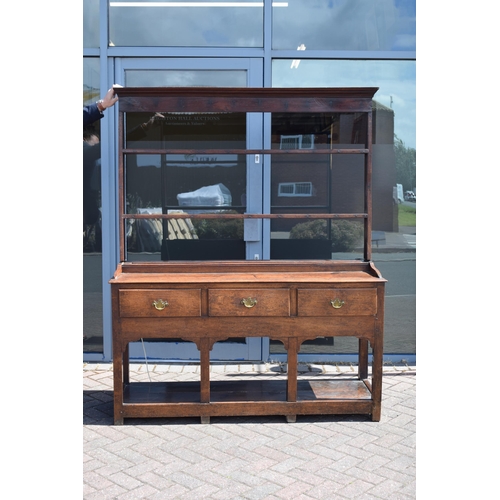 38 - Georgian oak dresser with three drawers to base, plank bottom, with oak plate rack, with later fitte... 