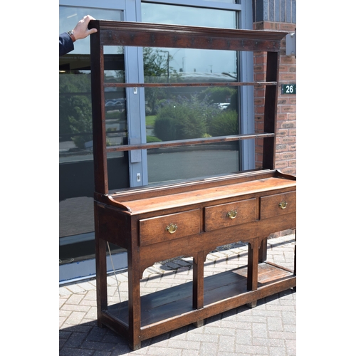 38 - Georgian oak dresser with three drawers to base, plank bottom, with oak plate rack, with later fitte... 