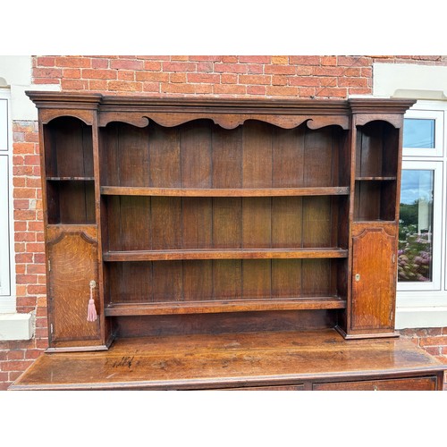 35 - 18th century oak dresser, brass fixtures and fittings, with plate rack, later plank backing, 186cm w... 