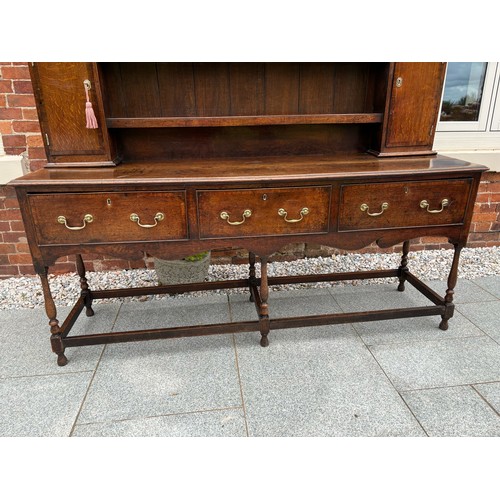 35 - 18th century oak dresser, brass fixtures and fittings, with plate rack, later plank backing, 186cm w... 