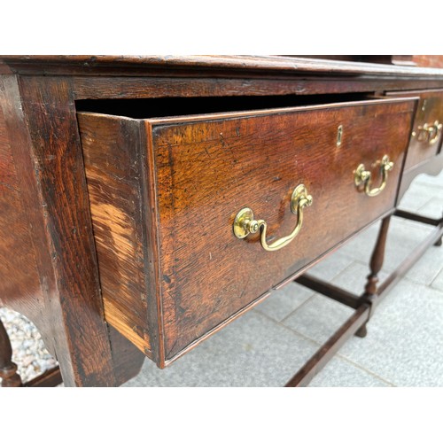 35 - 18th century oak dresser, brass fixtures and fittings, with plate rack, later plank backing, 186cm w... 