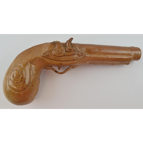 77 - 19th century brown salt glazed stoneware novelty flask, as a flintlock pistol, 24cm long.