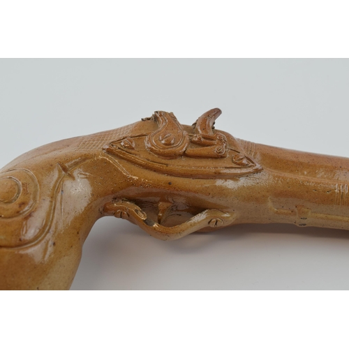 77 - 19th century brown salt glazed stoneware novelty flask, as a flintlock pistol, 24cm long.