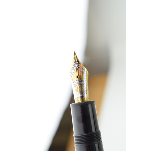 204 - Montblanc Anniversary 149 Fountain Pen in black with two broad and two narrow gold bands, upper cap ... 