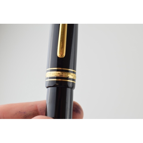 205 - Montblanc Meisterstuck 149 Fountain Pen in black with one broad and two narrow gold bands, 18ct bi-c... 