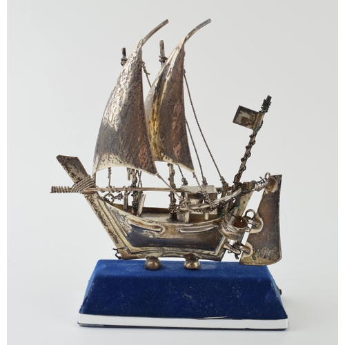 21 - A silver model of a sail boat with anchor. Marked .925. Height 13cm. Weight 62 grams.