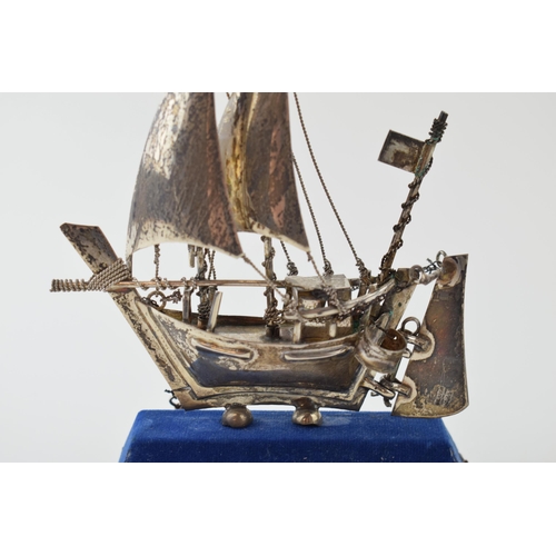 21 - A silver model of a sail boat with anchor. Marked .925. Height 13cm. Weight 62 grams.