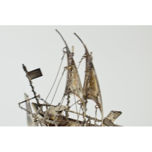 21 - A silver model of a sail boat with anchor. Marked .925. Height 13cm. Weight 62 grams.