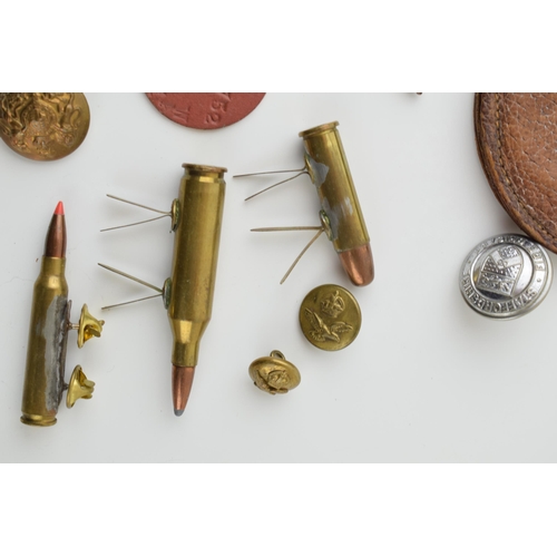 27 - A collection of military items to include A.R.P silver badge, Leather WWi pocket watch case and othe... 