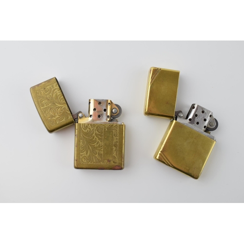 28 - Two vintage brass Zippo lighters. (2)