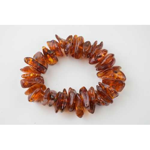 35 - Faux Amber bracelet on elasticated string.