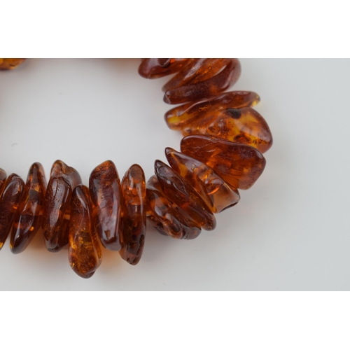 35 - Faux Amber bracelet on elasticated string.