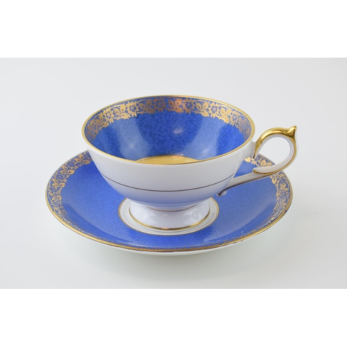 4 - Aynsley cup and saucer, Orchard Gold design with blue surround and gilt decoration. Height 7cm.