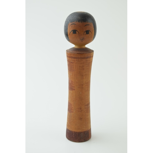 53 - A vintage Japanese Kokeshi doll. Hand-painted design on hand - turned body. Height 19cm.