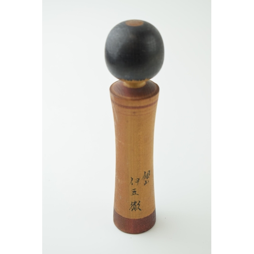 53 - A vintage Japanese Kokeshi doll. Hand-painted design on hand - turned body. Height 19cm.