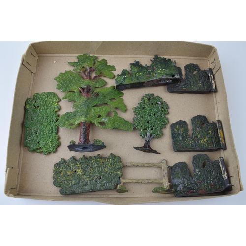 54 - A collection of pre-war Britains hollow cast lead trees and hedges. (Qty)