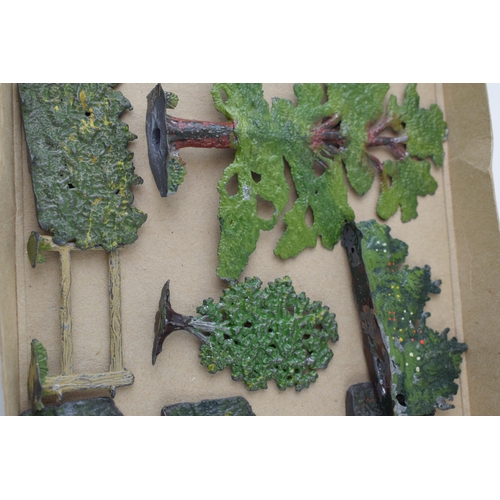 54 - A collection of pre-war Britains hollow cast lead trees and hedges. (Qty)