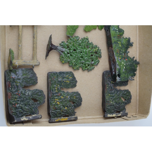 54 - A collection of pre-war Britains hollow cast lead trees and hedges. (Qty)