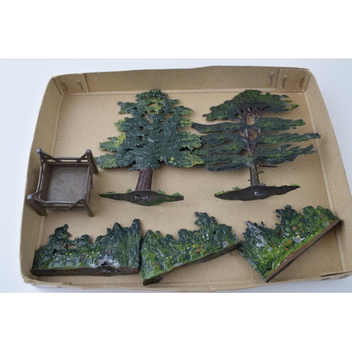 55 - A collection of pre-war Britains hollow cast lead trees and hedges. (Qty)