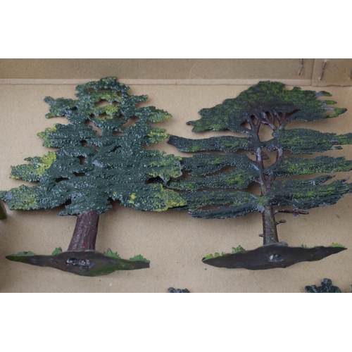 55 - A collection of pre-war Britains hollow cast lead trees and hedges. (Qty)