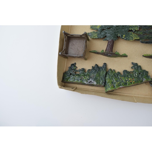 55 - A collection of pre-war Britains hollow cast lead trees and hedges. (Qty)