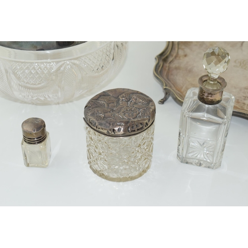 64 - A quantity of silver and silver-plated items to include two silver topped bottes and a silver topped... 